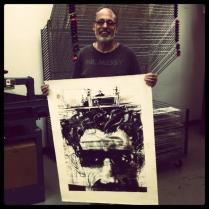 Bruce holding his art for the Robert Blackburn Printmaking Workshop.